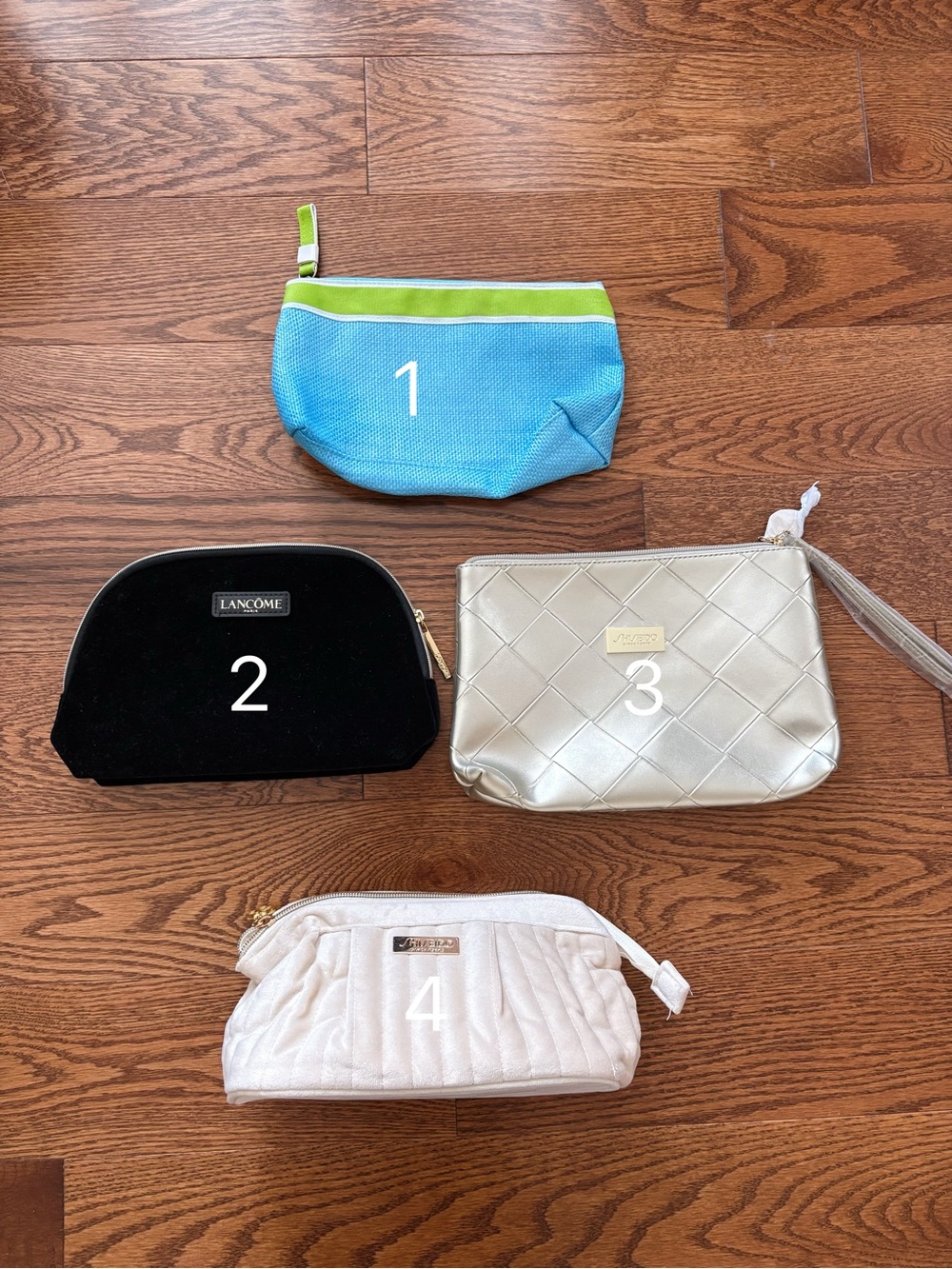 Brand new Lot of 4 Cosmetic Makeup Bags - Blue, Black, Golden, Cream